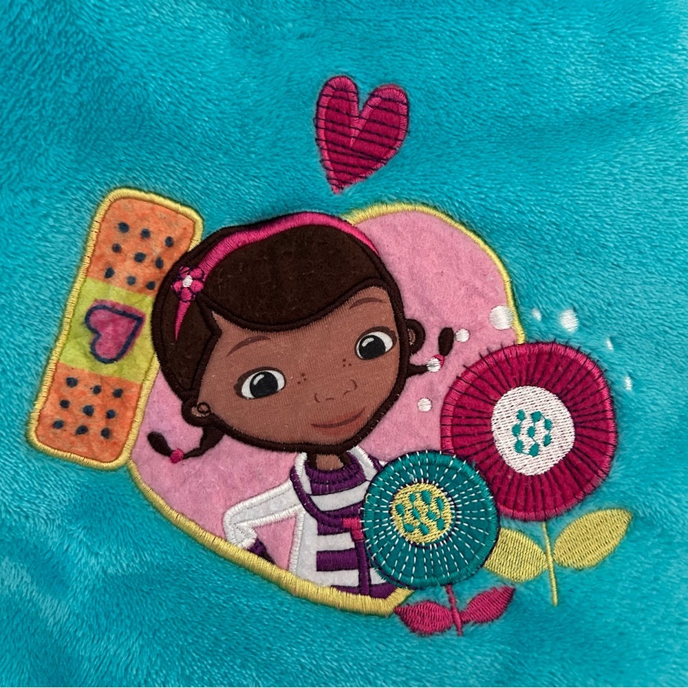 Disney Store Doc McStuffins blanket.